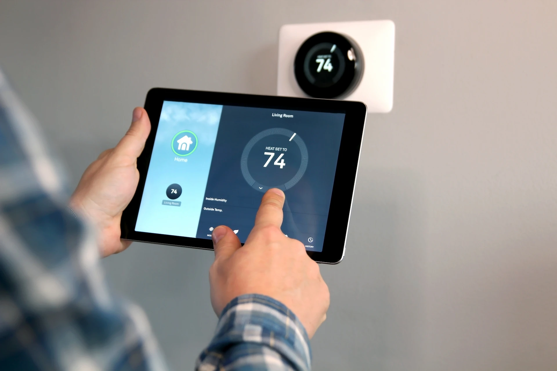 smart thermostat being controlled by ipad